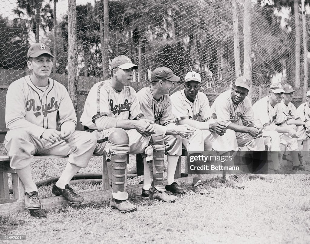 Jackie Robinson and Players Sitting on Bench