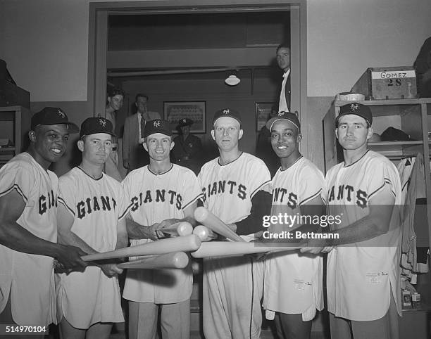 Six Giant players cross bats at the end of the game with the Dodgers, here on May 28th, during which all of them hit home runs. Left to right are...