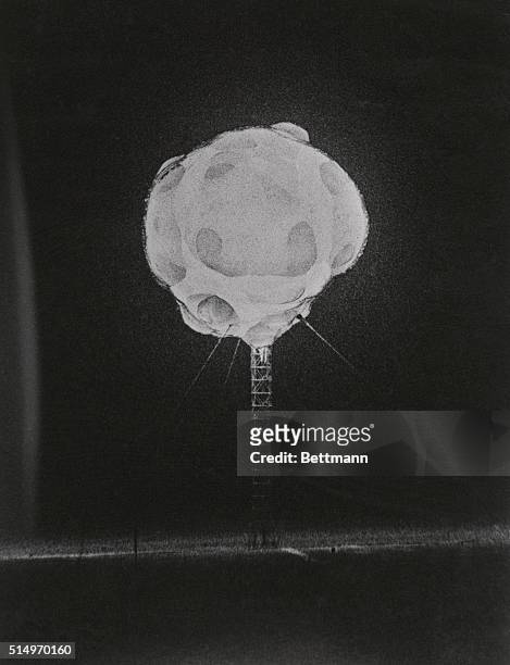 Frozen by a camera in few millionths of a second, the fiery ball from a nuclear device disintegrates a steel tower shortly after detonation at the...
