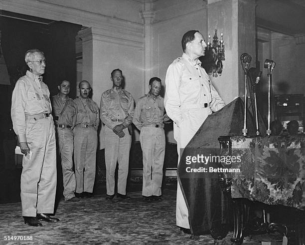 MacArthur Returns Civil Rule to Filipino President. Manila, Philippines: General of the Army, Douglas MacArthur, is shown addressing officials of the...