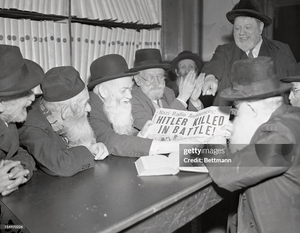 Jewish Elders Reading Headline of Hitler's Death
