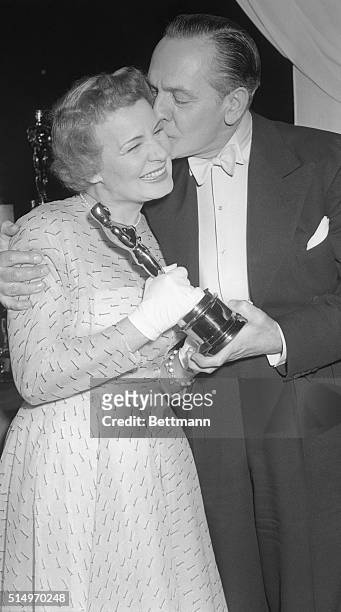 Shirley Booth Wins "Oscar." Manhattan, New York, New York: Two time Academy Award winner Frederic March kisses actress Shirley Booth after presenting...