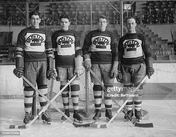 Star defense men of Boston hockey team...The four defense men of the Boston Bruins, battling the Rangers for the lead in the National Hockey League....