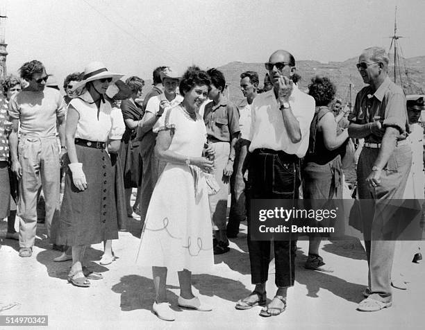 European royalty taking the cruise through the Aegan Sea aboard the Greek liner Agamemnon, wait for transportation after landing at the island of...