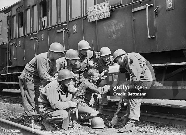 Germany: As GI's Heard Tragic News....these men of the U.S. Seventh Army were on guard at a German railway station, recently captured, when they...