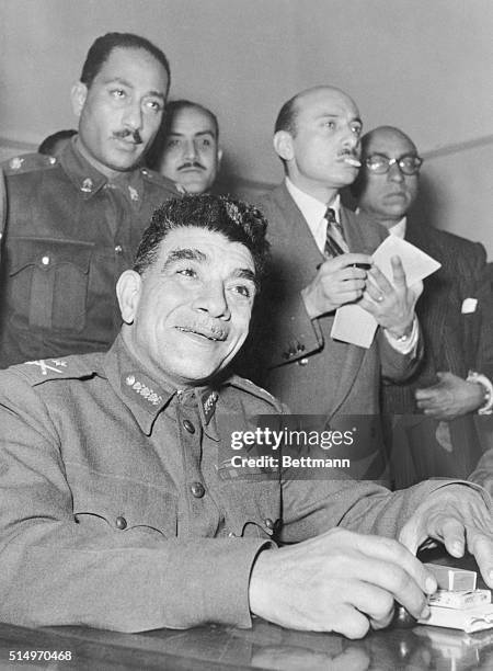 General Naguib, Egypt's "strong man," greets foreign correspondents with a smile here, just before the press conference on January 17th, at which he...