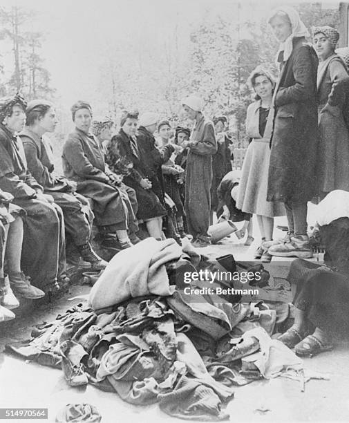 Women, Jewish from Budapest, mostly from cultured families were found by the U. S. 3rd Army in this camp. Piles of dirty clothes which Jewish women...