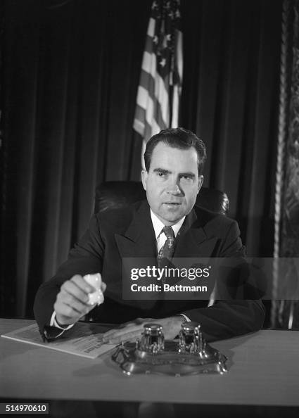 Richard M. Nixon Sitting Near American Flag