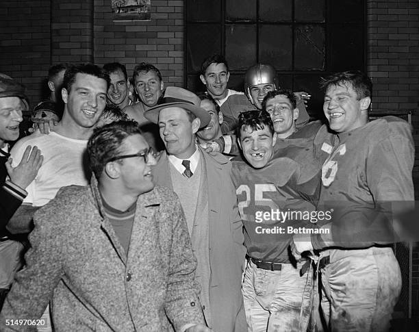 Jubilant Detroit Lions rejoice in their dressing room over their 17-7 win over the Cleveland Browns, December 28. Football championship team surround...