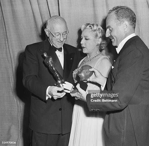 Producer Cecil B. De Mille accepts both an "Oscar" and the Irving Thalberg Award at the 25th Annual Academy Awards presentation ceremonies at the...