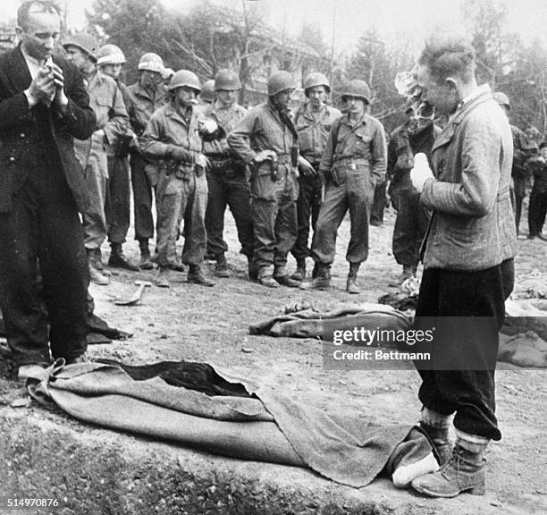 Pathetic scene of a young Polish boy whose grandmother was victim of the Nazis, one of 2,500 found dead in the Nordhausen concentration camp by...