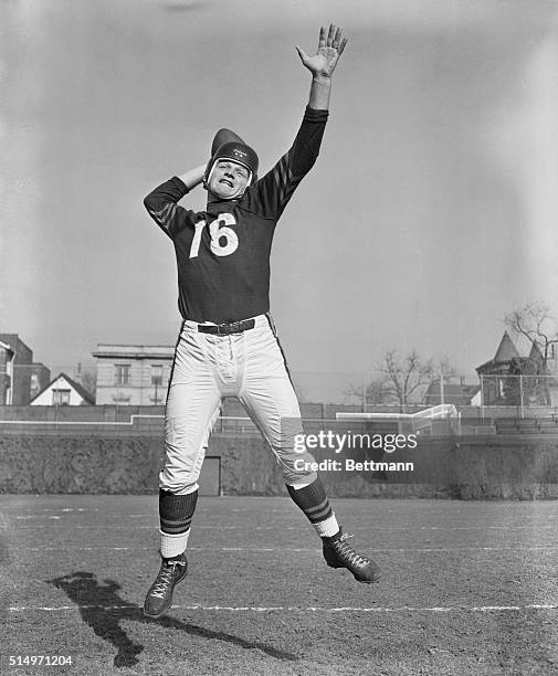 George Blanda, 27-year-old Quarterback of the Chicago Bears, throws a few warmup passes at practice session here. Blanda, who pulled the last two...