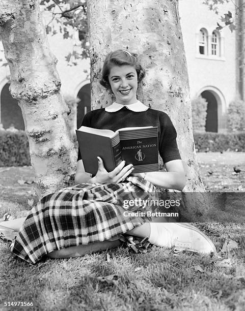 Lorna Young enrolled at the University of Southern California, with the unique title of "America's Prettiest Schoolgirl," is shown. Miss Young won...