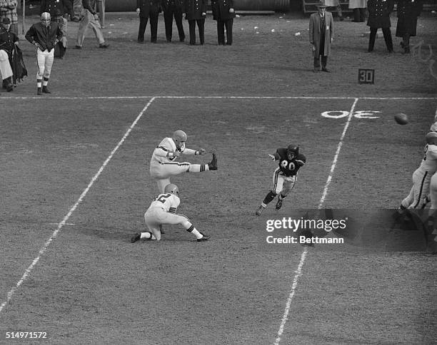 Lou Groza of the Cleveland Browns, kicks a field goal from Bears' 33rd-line for the first score of the game during the first quarter. Groza kicked...