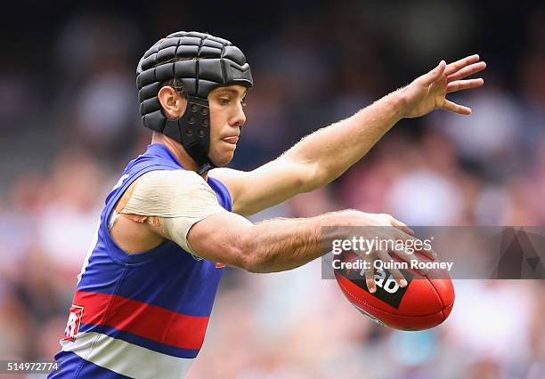 Caleb Daniel of the Bulldogs kicks during the 2016 NAB Challenge AFL match between the Collingwood Magpies and the Western Bulldogs at Etihad Stadium...