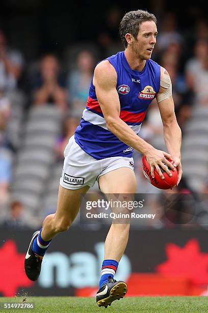 Robert Murphy of the Bulldogs kicks during the 2016 NAB Challenge AFL match between the Collingwood Magpies and the Western Bulldogs at Etihad...