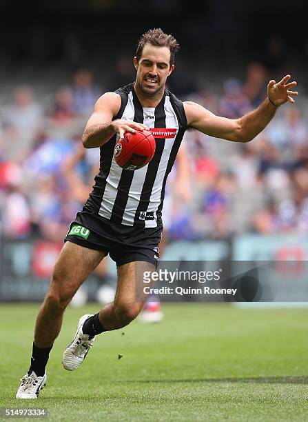 Steele Sidebottom of the Magpies kicks during the 2016 NAB Challenge AFL match between the Collingwood Magpies and the Western Bulldogs at Etihad...