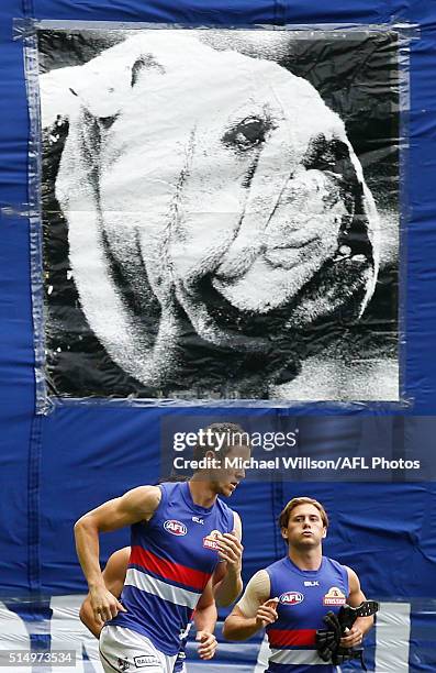 Robert Murphy and Caleb Daniel of the Bulldogs run onto the field during the 2016 NAB Challenge match between the Collingwood Magpies and the Western...