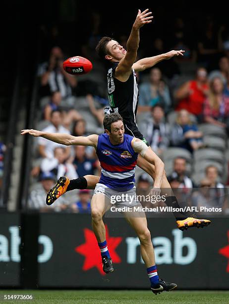 Darcy Moore of the Magpies and Toby McLean of the Bulldogs compete for the ball during the 2016 NAB Challenge match between the Collingwood Magpies...