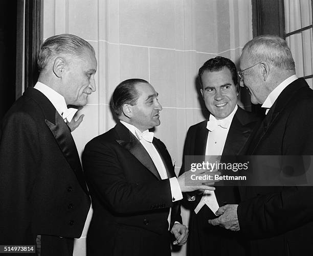 French Premier Pierre-Mendes- France chats with Vice President Richard Nixon and secretary of state John Foster Dulles at a dinner in his honor at...