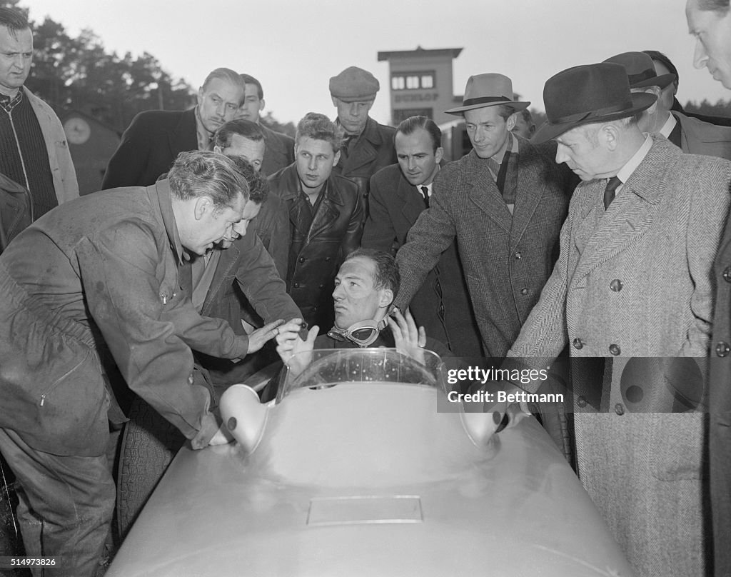 Stirling Moss Speaking to Car Builder Uhlenhaut