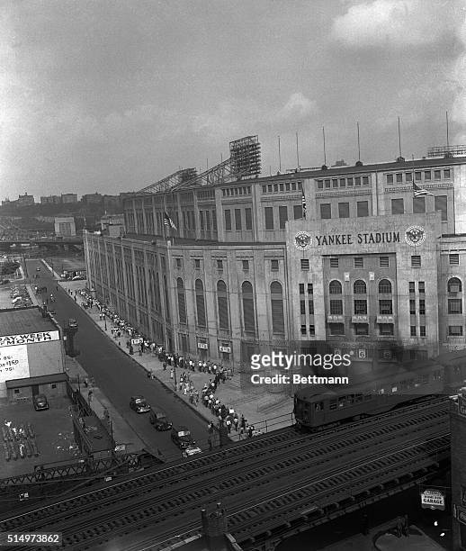 View from elevation of Yankee Stadium as thousands of persons, young and old, from all walks of life, formed long lines to pass before the bier of...