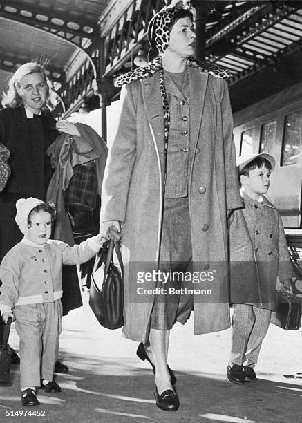Off to conquer Spain. Monte Carlo: Actress Ingrid Bergman arrives at the train station in Monte Carlo with two of her children, Ingrid [Isotta] and...