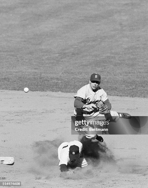 Off to First, But Too Late. New York, New York: Dodger shortstop Pee Wee Reese takes off as he relays to first base after making the force play on...