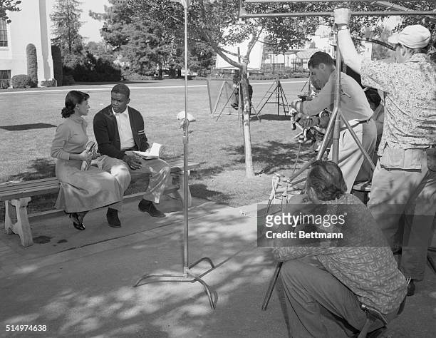 Jackie Robinson, famed Negro infielder for the Brooklyn Dodgers, went before the movie cameras today for the first scenes in his picture The Jackie...