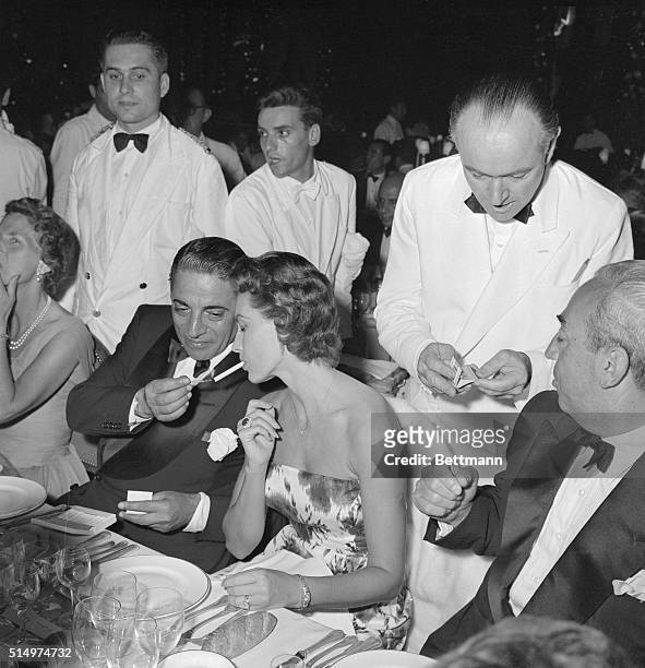 Light moment on Monaco is shared by actress Cyd Charisse and wealthy "tanker king" Aristotle Onassis. The star and shipping magnate were on hand for...
