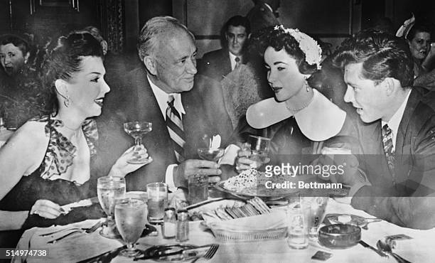 Bound for Europe. Chicago, Ill.: Conrad Hilton Jr., and his bride, Elizabeth Taylor, exchanged toasts with his father, the hotel magnate and...