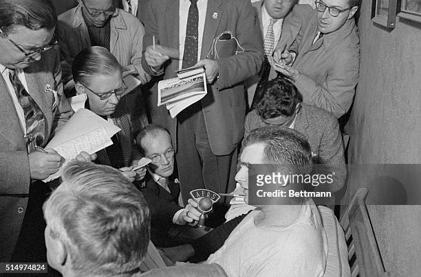 Yankee hurler Don Larsen is surrounded by newsmen in his dressing room at Yankee Stadium after the 27-year-old right hander pitched the first perfect...