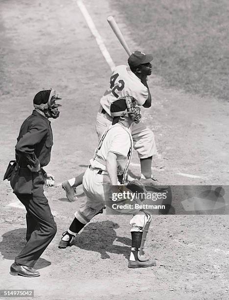 Jackie Robinson of the Brooklyn Dodgers is shown getting his 101st hit of the season in the third inning of the game against the New York Giants at...