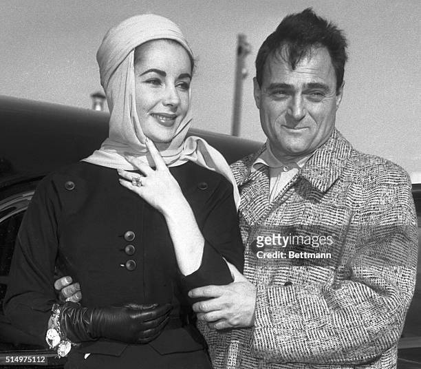 New York,NY-Actress Elizabeth Taylor & producer Mike Todd prepare to emplane at Idlewild Airport for Mexico City.The couple told reporters there is...