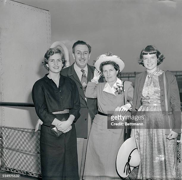 Among the voyagers on the Queen Elizabeth, which pulled out for Europe today, was the family of Walt Disney. Mr. And Mrs. Disney are shown just...