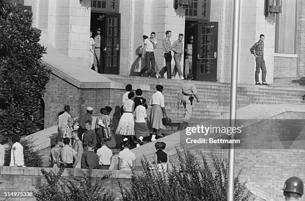 For the first time during the three weeks of integration at Central High School, no crowd of white students gathered on the main steps to watch the...