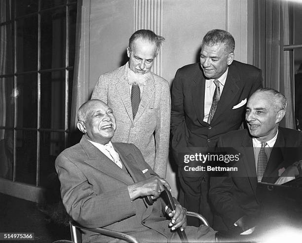 New York, New York- Getting together for a talk prior to a meeting of the SOngwriters' Protective Association here, are : composer, W.C. Handy;...