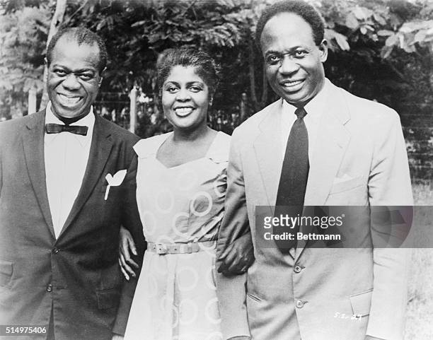 Jazz trumpeter Louis Armstrong and his wife Lucille were greeted by Ghana Prime Minister Kwame Nkrumah during Armstrong's tour of Europe and Africa...