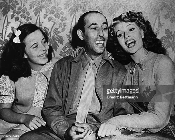 On the set of You Were Never Lovelier, in 1943 are Carmina Cansino, Rita Hayworth's cousin; Eduard Cansino, her father, and Rita. Carmina is the...
