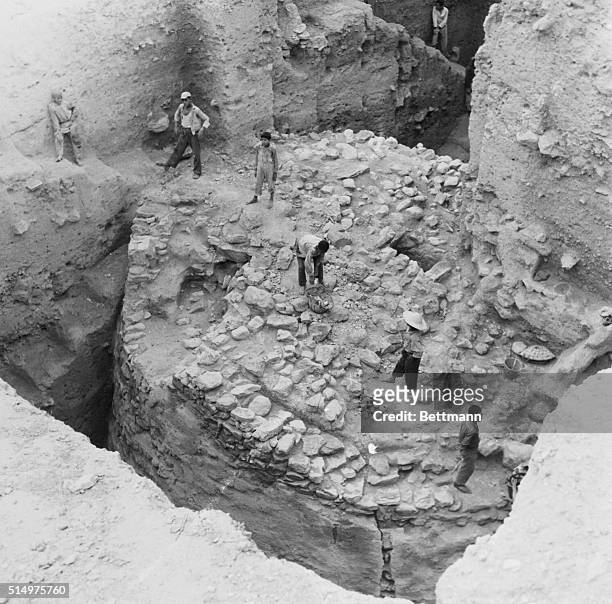 Jordanian workers, trained in archeological work, are seen on the top of a tower which is believed to date back to 7,000 B.C. The discovery was made...