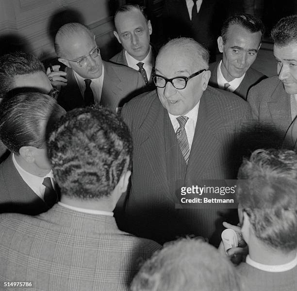 Italian premier Adone Zoli is surrounded by newsmen as he leaves the Viminale Palace after meeting of the Council of Ministers, March 17, at which...