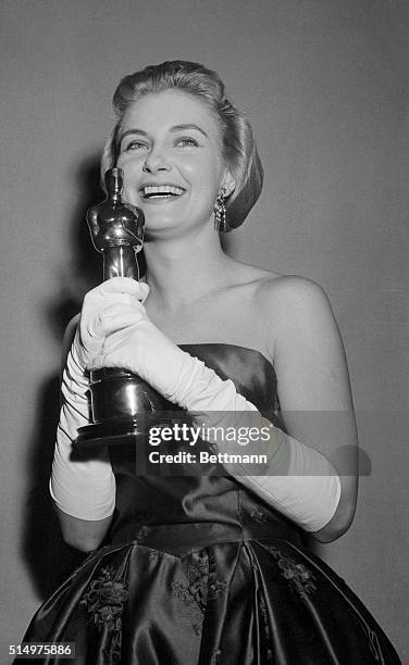 Smiles come easy to actress Joanne Woodward who poses here March 26th with her "Oscar" after she won the Academy Award as the best actress for her...