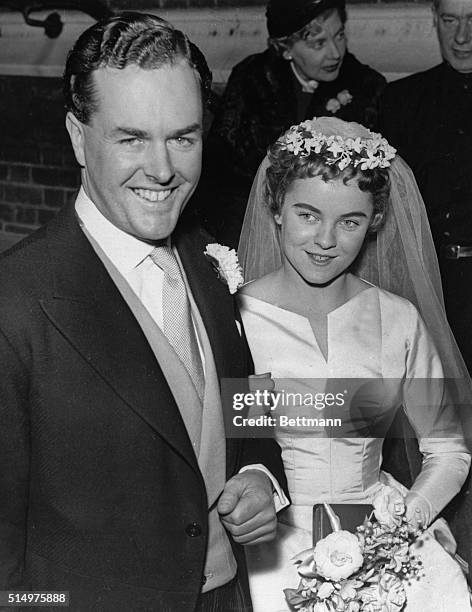 Suzanne Holman, 23-year-old daughter of actress Vivien Leigh by a former marriage, leaves Holy Trinity Church here December 6th with her new husband,...