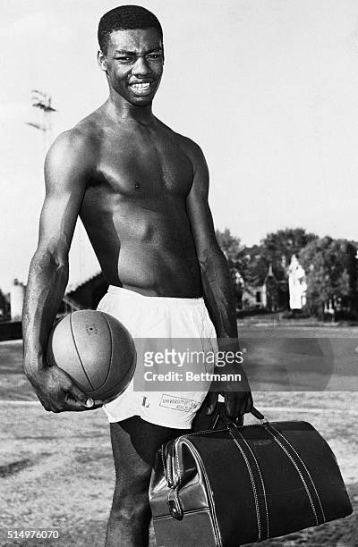 All Star basketball player Oscar Robertson, of the University of Cincinnati, appears to be the symbol of a fellow with "have ball-will travel." In...