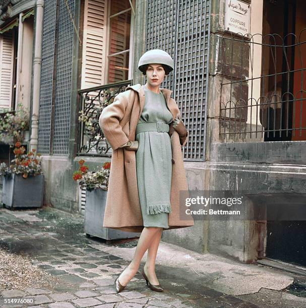 Paris Fashion Showings for Fall-Winter 1958-1959. Paris: For the cold winter afternoons Guy Laroche shows this smart ensemble. Dress is in wool in a...