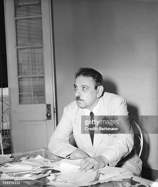 San Juan, Puerto Rico- Governor Luis Munoz Marin, first elected governor of Puerto Rico, looking over hundreds of cablegrams congratulating him on...