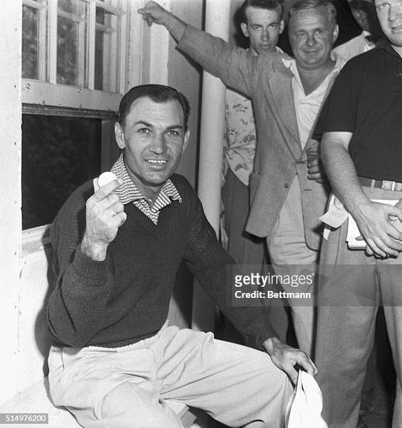 Making one of the most spectacular comebacks in modern sports history, Ben Hogan is shown holding his last putt ball after winning a three-way...