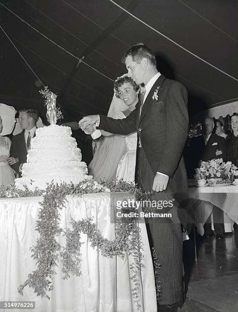 After their colorful wedding ceremony at St.Mary's Roman Catholic Church, Robert F.Kennedy and bride,former Ethel Skakel,are shown cutting their...