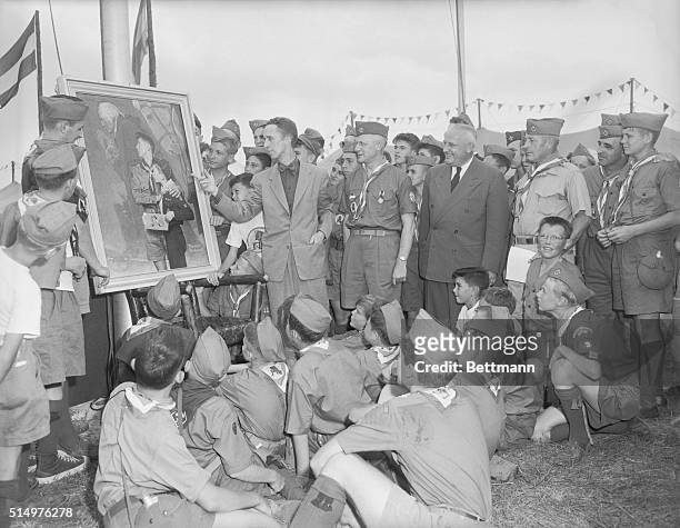 Famed artist Norman Rockwell, is shown pointing to his original painting of George Washington, as Chief Scout Executive Dr. Arthur A. Shuck, Vice...