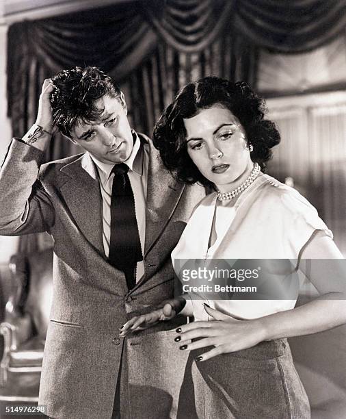 Hollywood, CA- In "Where Danger Lives" Faith Domergue emerges as a well-trained star. She is shown in a dramatic scene from the picture with Robert...